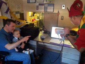 Young child getting a sight screen for vision at Lions Sight Committee.